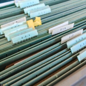 Organize files with filing cabinet