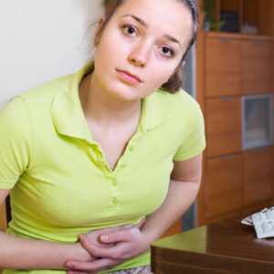 What are the symptoms of chronic constipation?